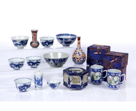Group of Chinese and Japanese pieces including four Chinese blue and white wine cups, each with dragon decoration, six charac