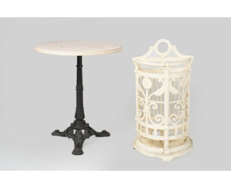 Cast iron stick stand with foliate designs, 40cm wide, 20cm deep, 75cm high and marble and cast iron circular occasional tabl