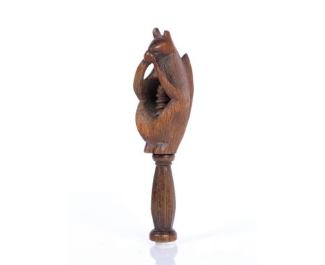 Victorian treen nutcracker in the form of a squirrel holding a nut, 15cm approx overall Condition: surface dust, dirt and scr