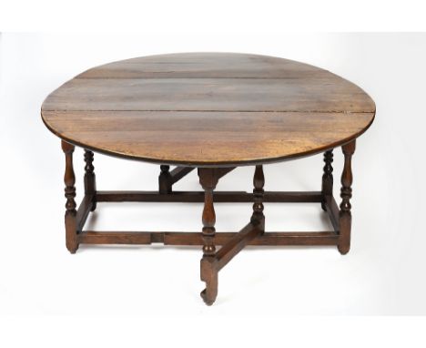 Large oak gate-leg dining table 18th Century, with two drop leaves and turned supports, 154cm long, 189cm wide, 72cm high Con