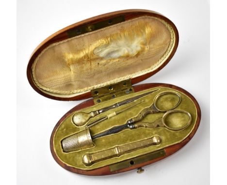 A late 19th/early 20th century oval étui/sewing kit, with inlaid geometric pattern to the lid, the fitted interior containing