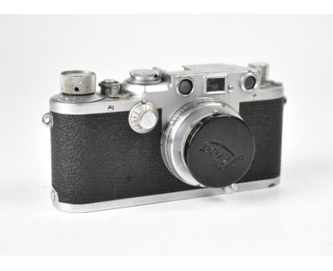 LEICA; an IIIf camera fitted with a Leitz Summar F=5cm 1:2 lens, with maker's cap and after market leather case. CONDITION RE