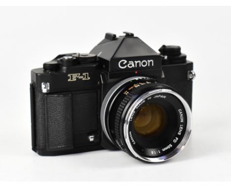 CANON; an F1 film camera, serial no.121523, fitted with a Canon 50mm 1:1.8 lens. CONDITION REPORT The camera body is in good 