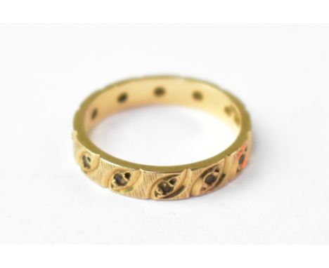 A vintage 9ct gold diamond eternity ring, the repeating swirl pattern each inset with a tiny white diamond, size K, approx 2.