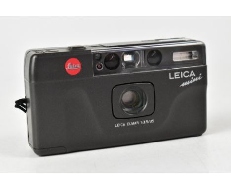 LEICA; a mini 35mm point and shoot film camera with fixed Elmar 35mm F3.5 lens and case. CONDITION REPORT The camera body is 