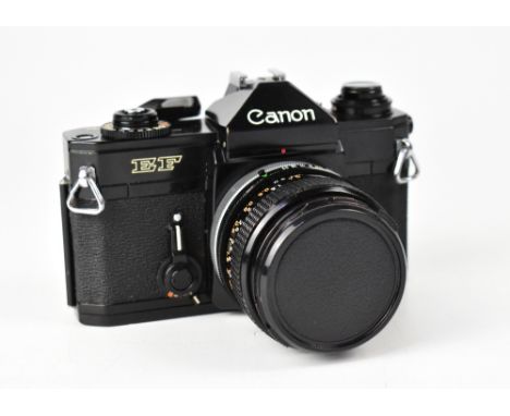 CANON; an EF film camera serial no.233052, fitted with a Canon 35mm 1:3.5 lens. CONDITION REPORT The camera body is in reason