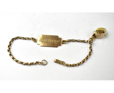 A 9ct gold dainty identity bracelet, with a panel inscribed 'Joan Ruxton' to the front and 'From Jansy' verso, together with 