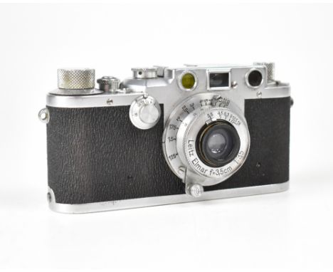 LEICA; an IIIc 'Sharkskin' camera fitted with a Leitz Elmar F=3.5cm 1:3.5 lens. CONDITION REPORT The camera body is in good c