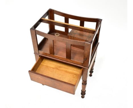 A 20th century mahogany Canterbury of simple form, with slatted sides, hidden frieze drawer, raised on turned tapering suppor