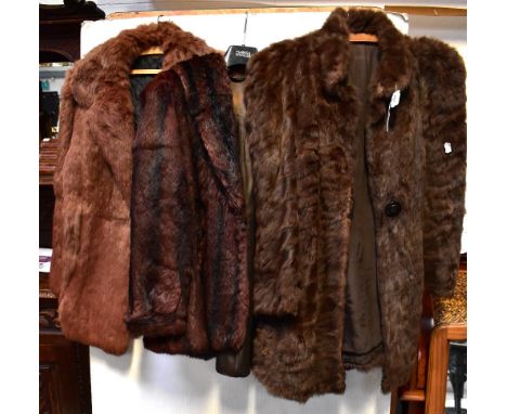 Three vintage fur jackets comprising a mid-brown jacket with faux tortoiseshell buttons and brown lining, a striped dark and 
