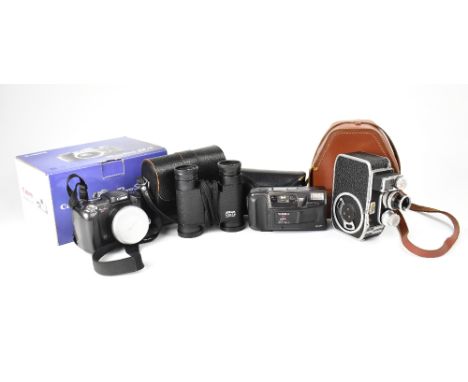 A small quantity of film and digital cameras to include a Yashica T3 Super, a Canon Powershot S2IS, a Paillard-Bolex B-8SL ci