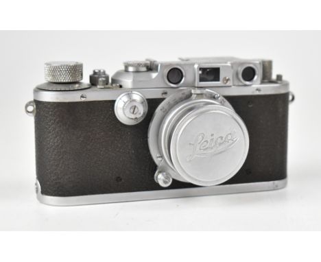 LEICA; an IIIb camera, serial no.321941, fitted with an Elmar F=5cm 1:3.5 lens, with Leica maker's cap and a leather Leica ca