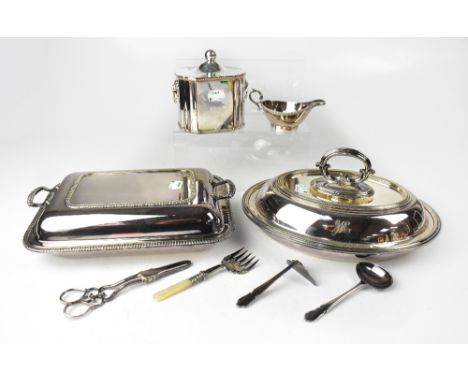 A quantity of silver plated items to include a tea caddy with lion mask handles, a pair of grape scissors and a small quantit