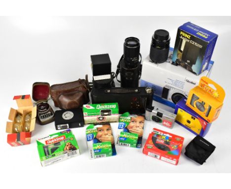 A large collection of cameras and camera equipment to include a Kodak folding Autographic Brownie, a Rollei DK4010 digital ca