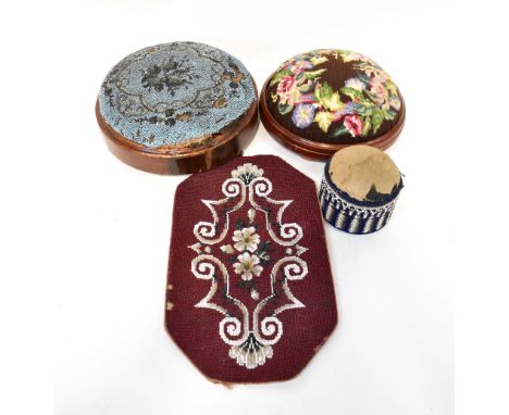 Two Victorian circular footstools, one with a tapestry top, the other with a beadwork example, a panel of beadwork with auber