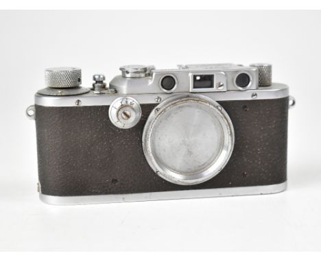 LEICA; an IIIa camera body, serial no.258390, with leather case. CONDITION REPORT The camera body is in overall fair conditio