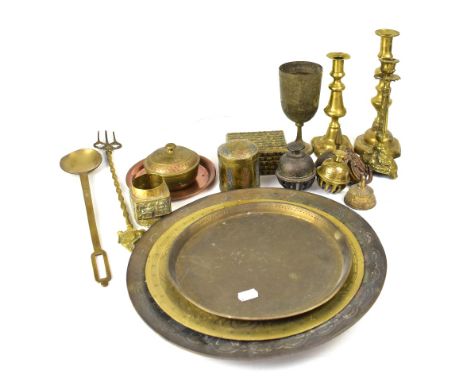 A quantity of vintage brassware to include trivet, candlesticks, various ornamental items, Eastern metal plates, Indian trink