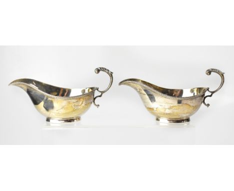 A pair of George VI hallmarked silver sauce boats, Sydney Wilkinson, Sheffield 1933, combined approx 8.6ozt (2).