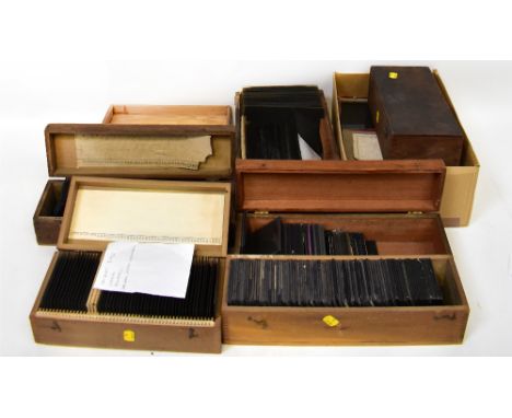 Three boxes of various glass and other lantern slides, three boxes of 1/4 plate slides, a box of 1/2 plates and various loose