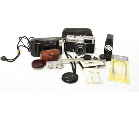 A small group of cameras and camera accessories to include an Olympus Trip 35, a Canon Sprint, flash gun etc.  CONDITION REPO