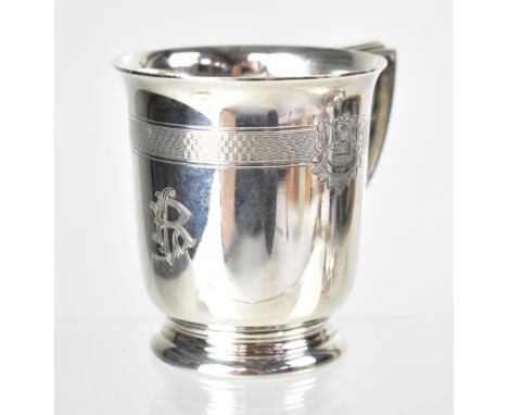 A George VI hallmarked silver children's cup, with engine turned border separated with floral garlands front and back, engrav