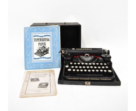 An early 20th century black cased Lanerwood typewriter and two packets of home and office typewriting assorted grade paper.