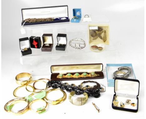 A large quantity of costume jewellery to include bangles, necklaces, bracelets, a silver filigree and rose quartz lotus flowe