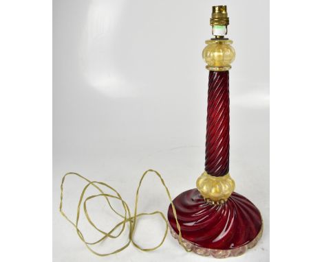 A cranberry and gilt wrythen twist glass table lamp, with spreading circular foot, height 43cm. CONDITION REPORT The upper se