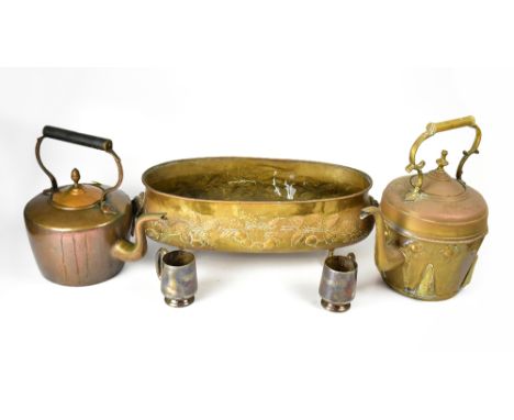 A quantity of collectible metalware to include an elongated brass oval planter with lion mask and ring handle, the body embos