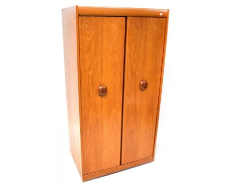 A retro 1970s teak two-door wardrobe.