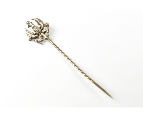 A silver regimental tie pin for the 20th Hussars Regiment, the pin in the form of an eagle, length approx 6cm. CONDITION REPO