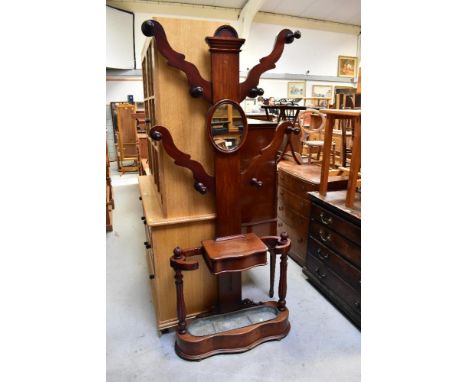 A 19th century mahogany hall stand with central column with four outswept branches, each containing two turned hat pegs, a ce