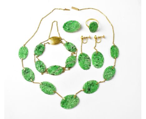 A Chinese 18ct gold and spinach jade parure of jewellery, comprising a necklace of seven graduated oval panels, each panel ha