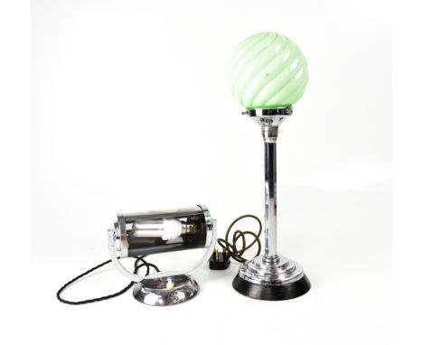 An Art Deco white metal column table lamp with opaque green glass globe shade, to stepped circular base and an Art Deco metal