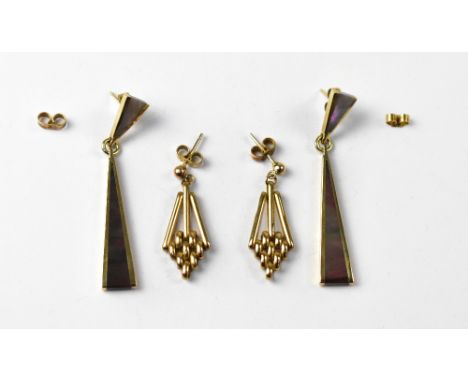 Two pairs of modern 9ct gold earrings comprising a pair of mother of pearl style inset triangular drops and a pair of triangu