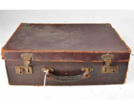 A small vintage brown suitcase containing a quantity of Victorian, Edwardian and later beadwork and beading for projects, to 