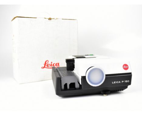 LEICA; a boxed Piso slide projector with additional lens. CONDITION REPORT The projector is in overall good condition. Sold e