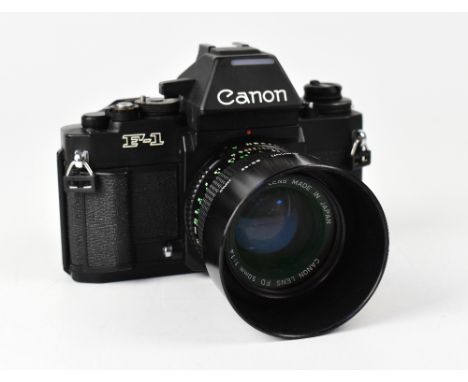 CANON; an F1 film camera, serial no.229209, fitted with a Canon 50mm 1:1.4 lens and hood. CONDITION REPORT The camera body is