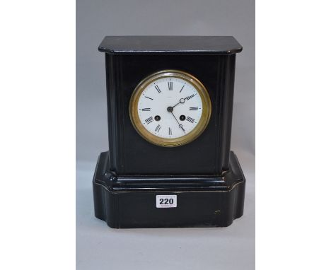 A LATE 19TH CENTURY CONTINENTAL BLACK SLATE MANTEL CLOCK, plain case with moulded detail, white enamel dial with Roman numera