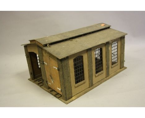 A WOODEN O GAUGE TWO ROAD ENGINE SHED, no makers marking, may be kit or scratchbuilt, in need of some attention, missing one 