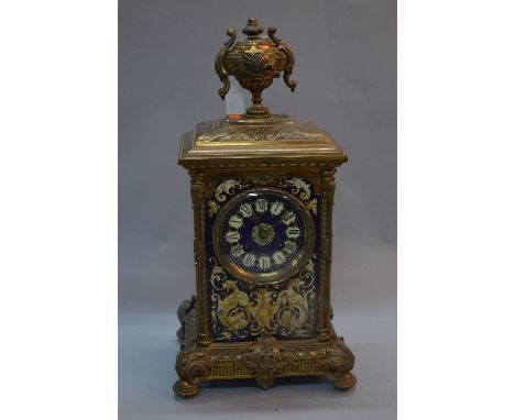 A LATE 19TH CENTURY CONTINENTAL BRASS AND PAINTED CASE MANTEL CLOCK, urn finial above a foliate cast pediment and four column