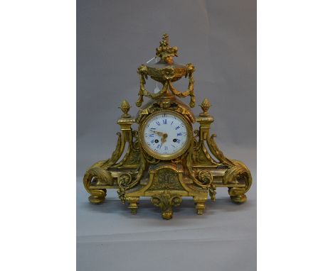 A MID 19TH CENTURY FRENCH ORMOLU MANTEL CLOCK, ornate floral urn surmount flanked by pineapple finials and central ribbon abo