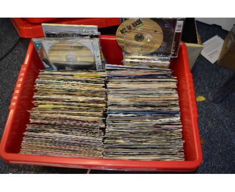 A BOX OF OVER 300 7'' AND C.D. SINGLES, from the 1960 to 1990 including The Beatles, The Rolling Stones, Elvis Presley, etc