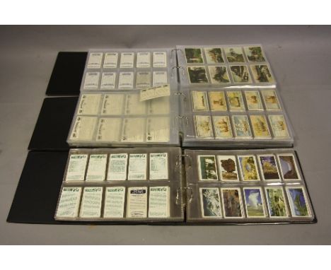 THREE ALBUMS OF CIGARETTE AND TRADE CARDS, all complete sets, manufacturers include Brooke Bond Tea, Ringtons Ltd, Cavanders,
