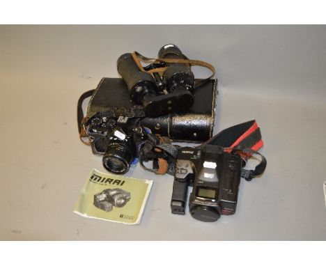 A CASED PAIR OF LEITZ 7 X 50 BINOCULARS, a Zenith 12XP SLR and a Ricoh Mirra camera