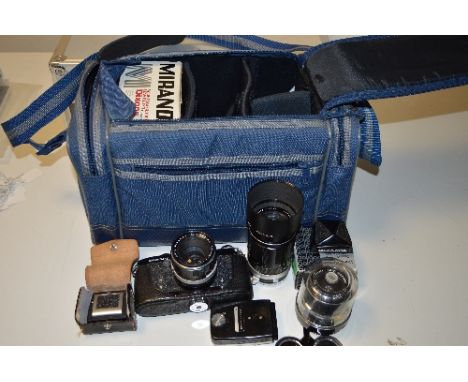 A SOFT CAMERA CASE WITH A MIRANDA SENSOMAT RE SLR, two extra viewing heads, a 135mm 1:2.8 lens, a 35mm 1:2.8 lens, a lens kit