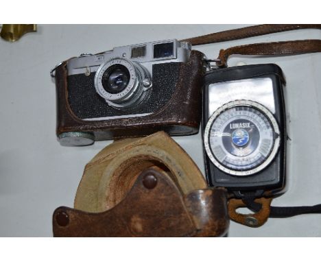 A LEICA M1 CAMERA, and a Gossen Light Meter, the camera serial No.967 045 and comes in its leather case