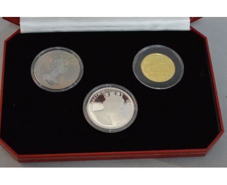 A HALF OUNCE GOLD COIN, together with sterling silver and Titanium coin in an Isle of Man, Past, Present and Future Millenniu
