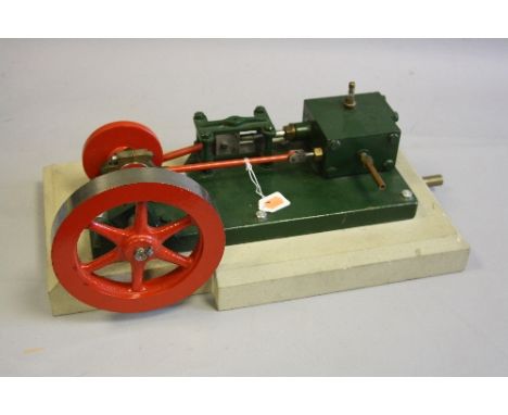 A HORIZONTAL SINGLE CYLINDER LIVE STEAM STATIONARY ENGINE, not tested, no makers markings, diameter of flywheel approximately