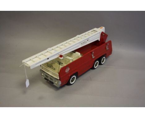 A LARGE SCALE TONKA TOYS PRESSED STEEL FIRE ENGINE, Canadian made version, missing one fire extinguisher from rear and additi